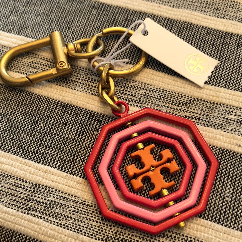 Authentic New with tag. Octagon Key Charm with Gold Hardware
